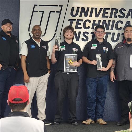 A group of men including two students with awards